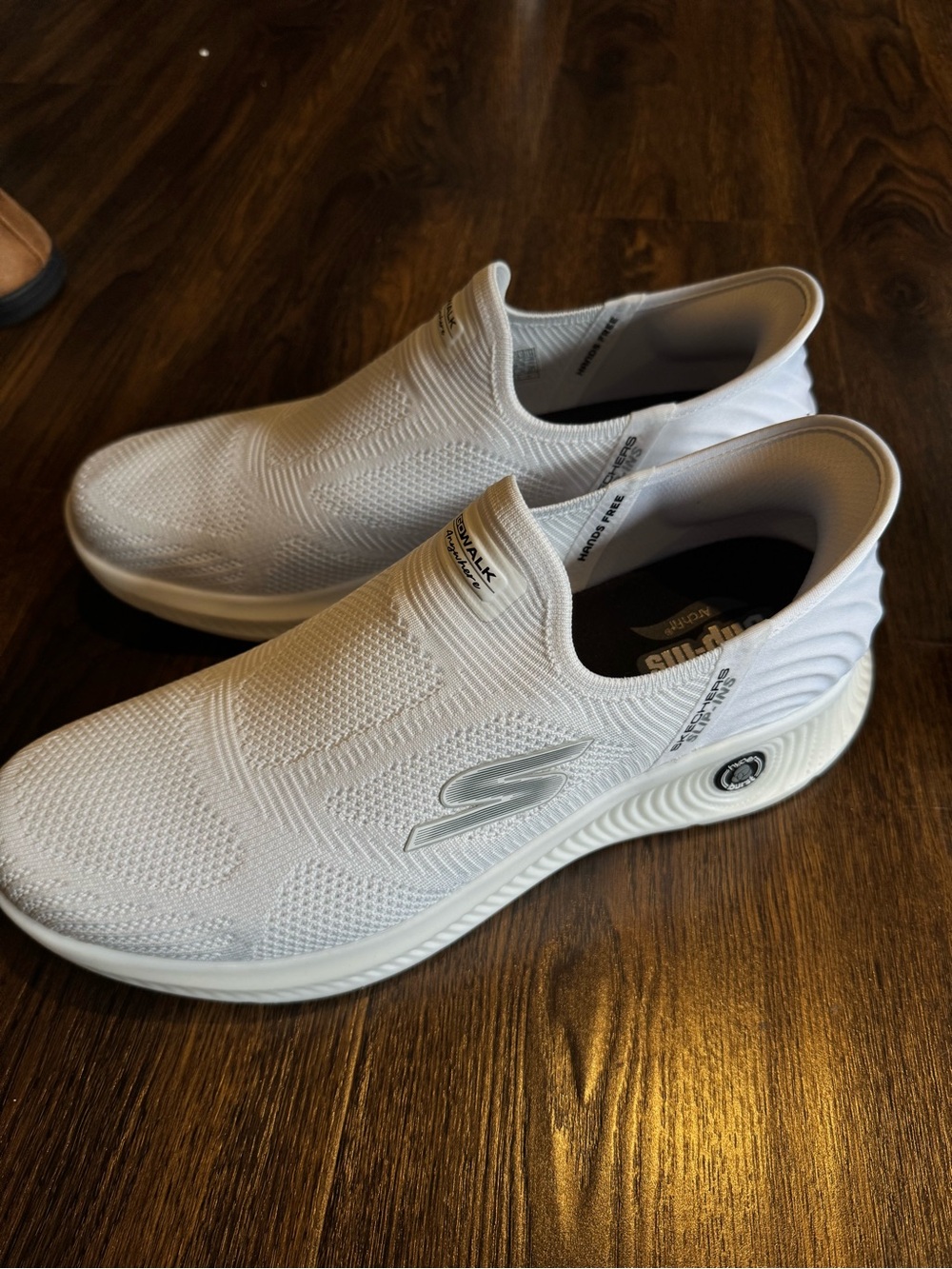 Skechers Men's Slip-On Sneakers in White with Silver Logo